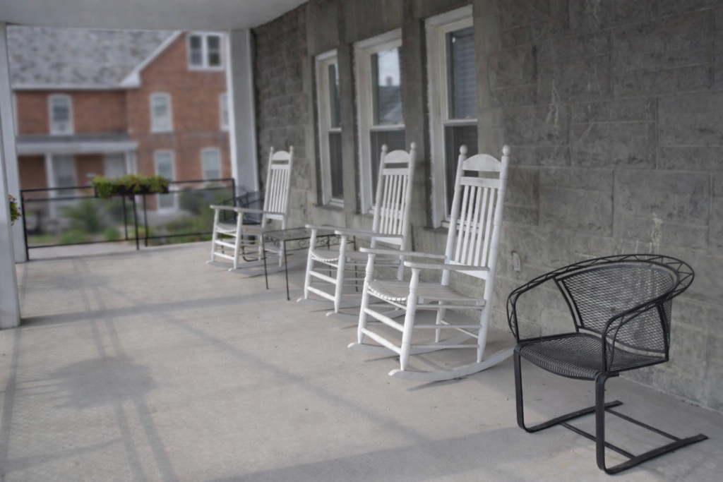 Hearthstone Retirement Home covered front porch with seating