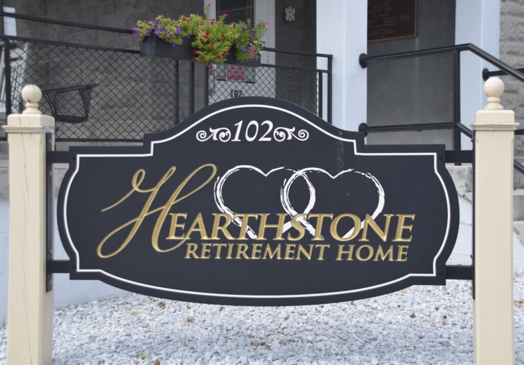 Hearthstone Retirement Home entrance sign at the front of the building